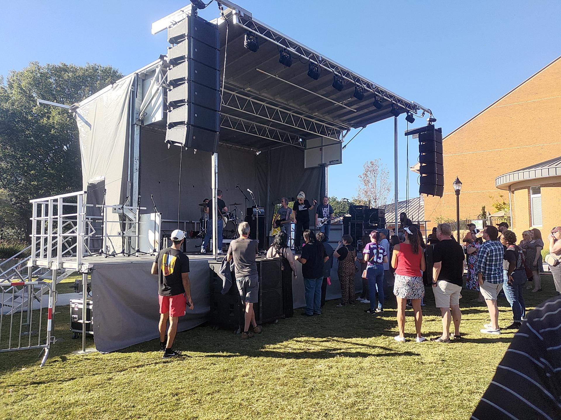 Letters to Cleo getting setup on a band stand in the Smyrna Village Green.